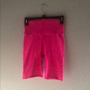 Fabletics bright pink biker shorts